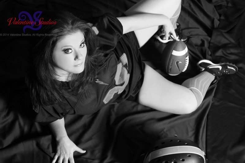 This gorgeous woman gets her game time pose during her boudoir photo session at Valentine Studios.